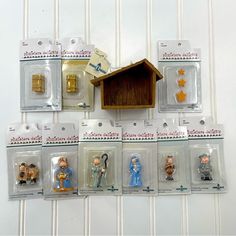 small plastic figurines are displayed on the wall