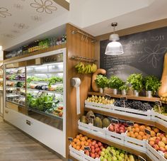 a grocery store filled with lots of fresh fruits and vegetables