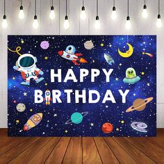 an image of a birthday card with space and stars on it in front of a wooden floor