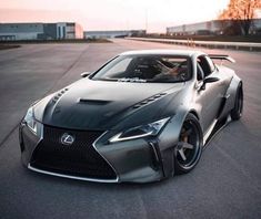 a silver sports car is parked on the street