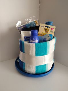 a blue and white basket with items in it