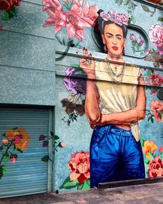 an image of a woman painted on the side of a building