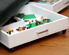 two lego drawers are open on the floor