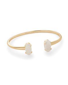 Bookended by two frameless oval stones, the Edie Gold Cuff Bracelet in White Opal is a staple for your stack. This timeless cuff bracelet can be worn anywhere and with anything, and even features an adjustable fit. If you're ever in doubt about how to accessorize, the Edie Gold Cuff Bracelet will never let you down. Edie Rose, White Opal Bracelet, Rose Gold Cuff Bracelet, Floating Diamond Necklace, Kendra Scott Bracelet, Gold Cuff Bracelet, Stone Bangle, Solitaire Necklaces, Gold Bracelet Cuff