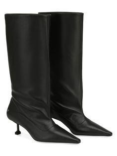 Introducing Tate, our mid-calf wide leg point boots, featuring a comfortable wide leg design and a chic 5 cm / 1.9'' heels. The pointed toe adds a touch of elegance, making these boots perfect for any occasion. Crafted from high-quality soft leathers, they offer both durability and effortless style. 5 cm / 1.9'' heel height 100% leather upper Small stainless steel wolfe head logo Pointed toe shape Custom new designed Naked Wolfe heel Full leather insole featuring new embossed logo Custom outsole Naked Wolfe, Pointed Boots, Leg Design, Embossed Logo, Mid Calf, Effortless Style, Soft Leather, Leather Boots, Heel Height