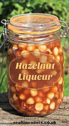 a jar full of hazelnut liqueur sitting on top of a wooden table