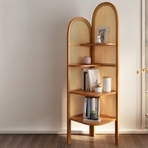 a wooden shelf with books on top of it next to a door and window in an empty room