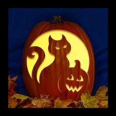 a carved pumpkin with two cats on it