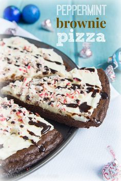 chocolate peppermint brownie pizza with white frosting and sprinkles