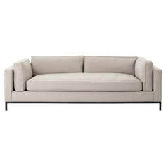 a white couch sitting on top of a wooden frame