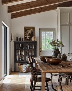 an instagram page with a wooden table and chairs