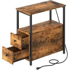 an old wooden desk with two drawers on one side and a power cord in the other