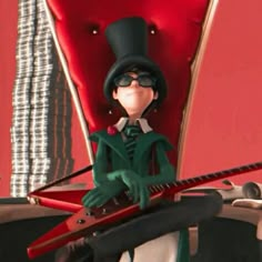 the animated character is wearing a top hat and holding a guitar