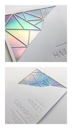 two white business cards with iridescent foil on the front and back of them