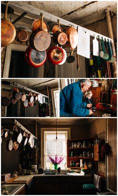 there are many pans hanging from the ceiling in this kitchen and on the wall