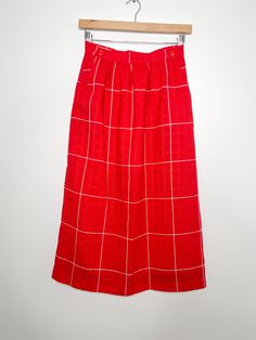 "Vintage red and white plaid skirt with two buttons in the front. Skirt is in a pencil skirt style with pockets and fits below the knees made from 50% Polyester and 50% Wool.  Fully lined skirt with a red and black lace lining.  In good vintage condition with no sign of wear,there is a small black stain on the front noted in the photographs but otherwise no sign of defects. MEASUREMENTS: Taken while garments are laying flat. Size: 8 - Medium  Waist: 13.5\"  Hips: 20\" Length: 31.5 Size: pencil s Red Midi Skirt With Pockets, Plaid Lined Skirt For Workwear, Plaid Relaxed Work Skirt, Retro Red Long Skirt, Retro Red Midi Skirt, Style Jupe, Vintage Pencil Skirt, White Plaid Skirt, Red And White Plaid