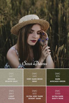 a woman wearing a straw hat and holding her hand to her face in front of some tall grass