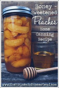 honey sweetened peaches in a jar with a wooden spoon