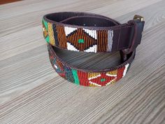 Handmade Unisex Beaded Belt | Boho, Tribal, and Festival Fashion Accessory for Men & WomenTO MEASURE CORRECTLY Our measurements are from the tip of the Buckle of the Collar to the second hole after the beaded section. GENERAL BELT SIZE NUMERICAL BELT SIZE WAIST MEASUREMENTS(INCHES) XS 30 26.5-28 S 32 28.5-30 M 34 30.5-32 M 36 32.5-34 L 38 34.5-36 L 40 36.5-38 XL 42 38.5-40 XL 44 40.5-42 2XL 46 42.5-44 3XL 48 44.5-46 4XL 50 46.5-48 Features: **Unisex Design: Suitable for both men and women, this Leather Beaded Belt, Adjustable Handmade Multicolor Belt, Handmade Bohemian Multicolor Belt, Bohemian Brown Fabric Belt, Adjustable Brown Beaded Belt, Festival Mode, Boho Mode, Beaded Belt, Suspender Belt