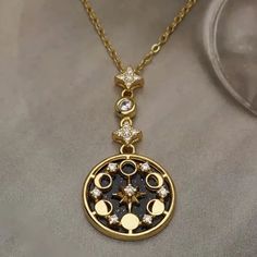 Luxury Symbolic Pendant Charm Necklaces, Affordable Silver Sun And Moon Jewelry, Luxury Amulet Charm Necklaces, Luxury Celestial Moonstone Necklace, Luxury Amulet Necklace With Round Pendant, Luxury Moon-shaped Jewelry For Anniversary, Luxury Rose Gold Jewelry With Moon Phase, Luxury White Gold Moon Phase Jewelry, Luxury Pendant Jewelry For Festival