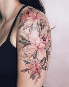 a woman with a flower tattoo on her arm