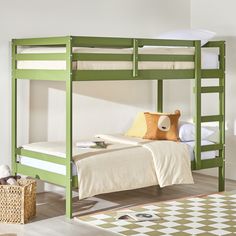 a green bunk bed with white sheets and pillows on top of it in a room