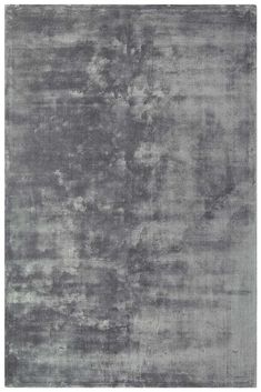 an area rug with grey and white colors