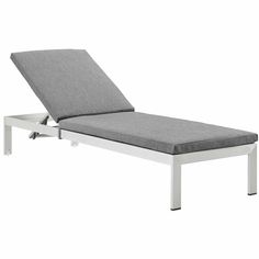 an outdoor chaise lounge chair with grey cushions and white frame, viewed from the side