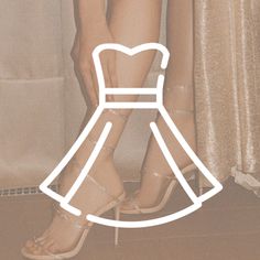 a woman standing next to a white curtain wearing high heeled shoes with a dress on it