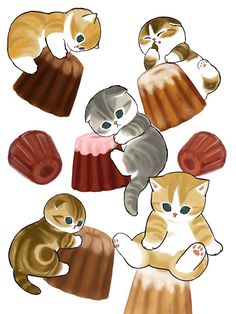 several cats sitting on top of each other in front of a cupcake and cake