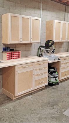 a workbench with many cabinets and tools in it