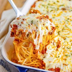 a casserole dish filled with cheese and sauce