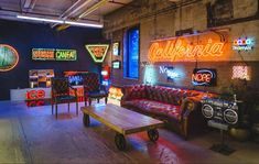 a room filled with furniture and neon signs