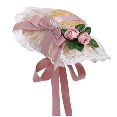 a small hat with pink flowers on it