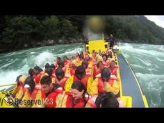 a group of people riding on the back of a boat