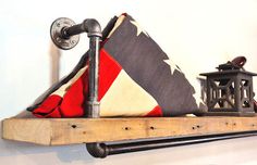 two shelves with american flags on them, one is made out of wood and the other has metal pipes