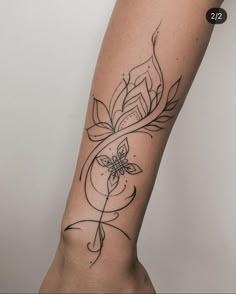 a woman's arm with a tattoo on it and a flower in the middle