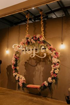 a wedding arch decorated with pink and white flowers