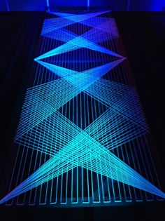 an image of some lights that are in the dark with blue and purple lighting on them