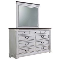 a white dresser with a mirror on top of it