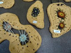 several pieces of wood with designs on them