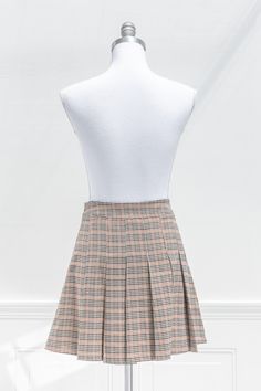 Inspired by vintage academia, the Elisa mini skirt features a pleated hem, brown plaid print, and a short length. Perfect with tights, a cardigan, and beret for a french-inspired collegiate look! . Details: S: Waist 28", Length 16" M: Waist 30", Length 16.5" L: Waist 32", Length 17" Unlined 97% Polyester, 3% Spandex Hand Wash Cold / Hang Dry Imported Ships in 1 to 2 Business Days Free US Shipping on Orders over $100 Pleated Short Skirt, Vintage Academia, Skirt Collection, French Girl Style, Plaid Mini Skirt, Brown Plaid, French Inspired, French Girl, Halloween Dress