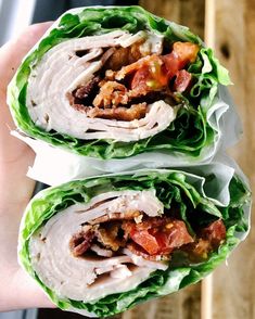 two wraps filled with meat, lettuce and tomatoes