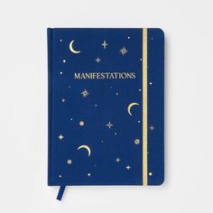 a blue notebook with the words mahestations written in gold foil on it