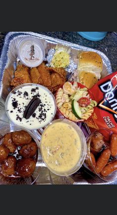 an assortment of food items on a plastic tray