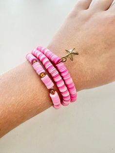 Preppy pink is a bracelet collection are perfect for pink lovers! All bracelets are pink with some a little bit of gold. Trendy Pink Heishi Beads Friendship Bracelet, Trendy Pink Heishi Beads Stretch Bracelet, Pink Heishi Beads Bracelets For Vacation, Trendy Pink Heishi Beads Bracelet, Pink Heishi Beads Vacation Bracelets, Handmade Pink Beaded Bracelets For Beach, Handmade Pink Stretch Bracelet For Beach, Pink Heishi Beads Colorful Beaded Bracelets, Pink Heishi Beads Friendship Bracelets For Vacation