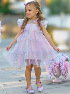 Your precious girl will look and feel like an enchanting princess in this magical tiered ruffle dress. Decorated with moon and star sequins, this rainbow number will have her shining and beaming with joy with every step!  Lightweight fabric feels good on her skin, keeping her cool and comfy even on warm summer days. Re Bday Dress, Kid Birthday Outfits, Toddler Birthday Dress, Star Sequins, Mermaid Theme Birthday Party, Princess Dress Kids, Pastel Girl, Fairy Birthday Party, Magical Rainbow