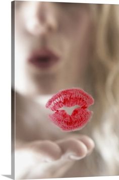 a woman's lips are red and the image is blurry