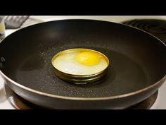 an egg frying in a skillet on the stove