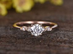 an engagement ring with three diamonds on it